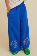 Wide-leg bukser med solbroderi